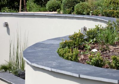 Curved-retaining-wall-with planting
